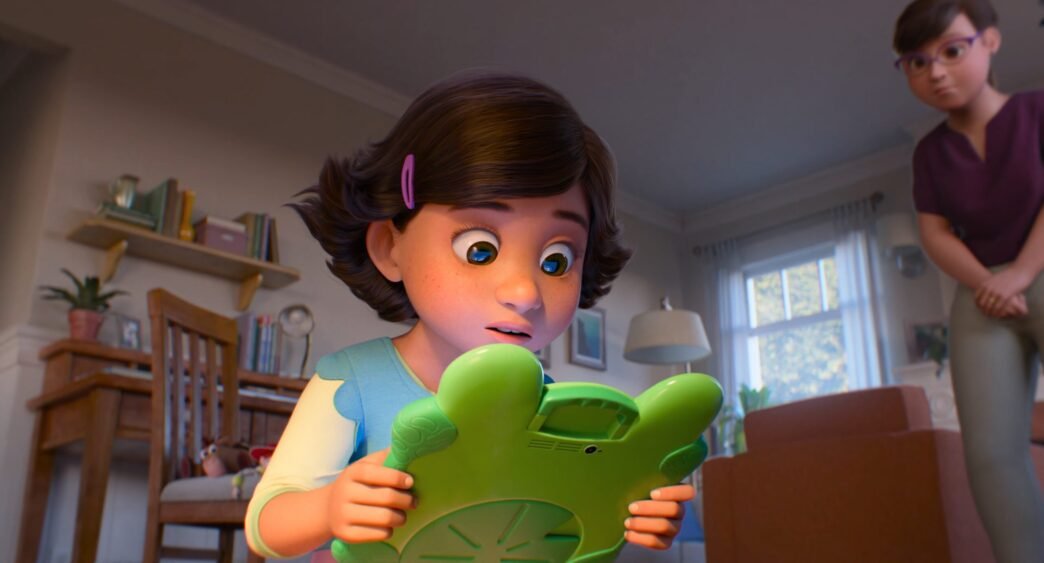 Bonnie sorprendida sosteniendo Lilypad, una tableta verde con forma de rana, en Toy Story 5